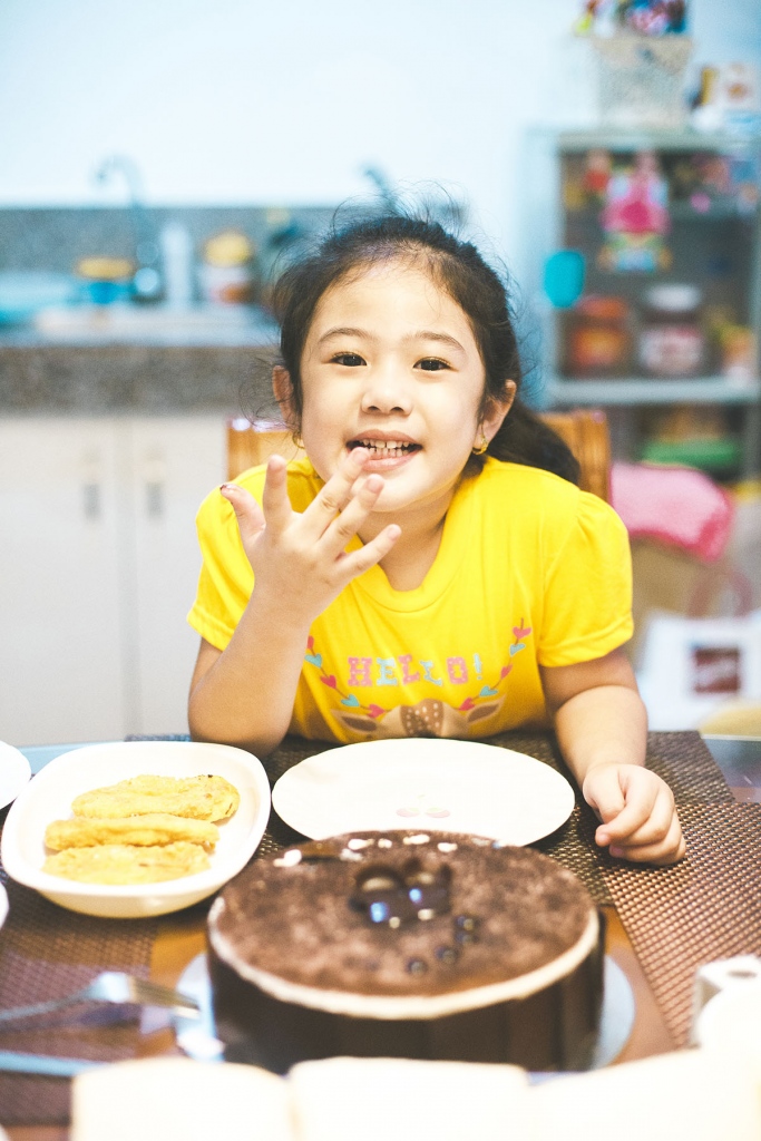 Playing with them is half the battle won during portrait sessions with kids